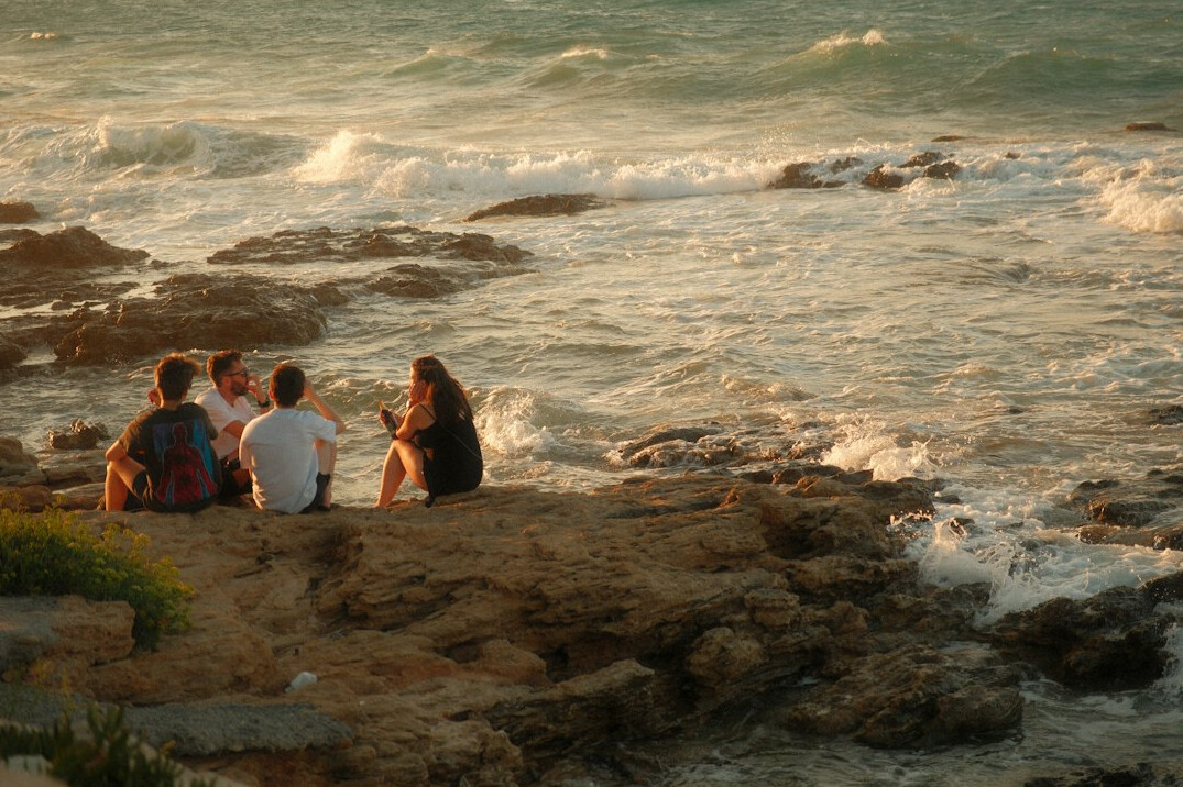 Group of diverse people engaged in a friendly conversation circle